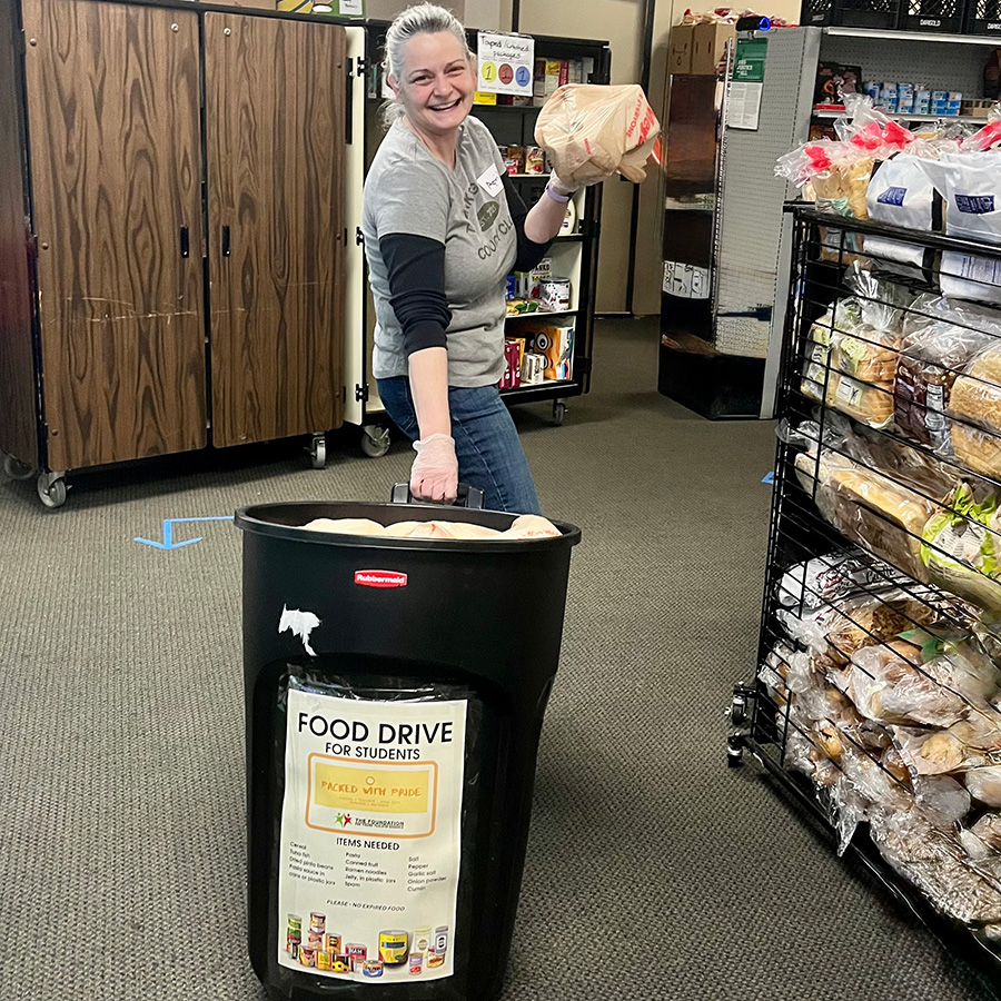 food drive bucket inside Packed with Pride